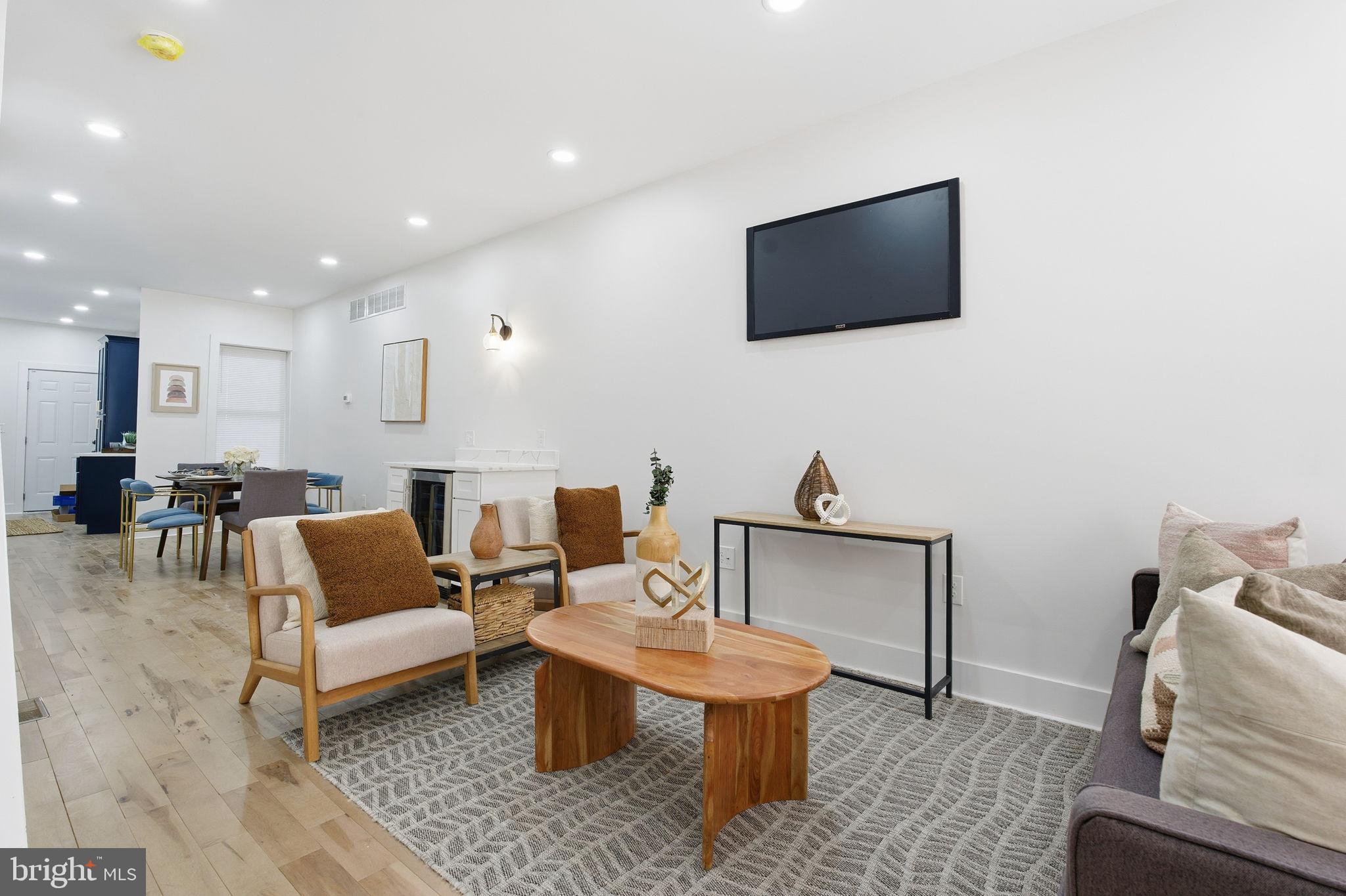 1742 East Oliver Street Baltimore, MD 21213 - Photo 4 of 36 a living room with furniture and a flat screen tv