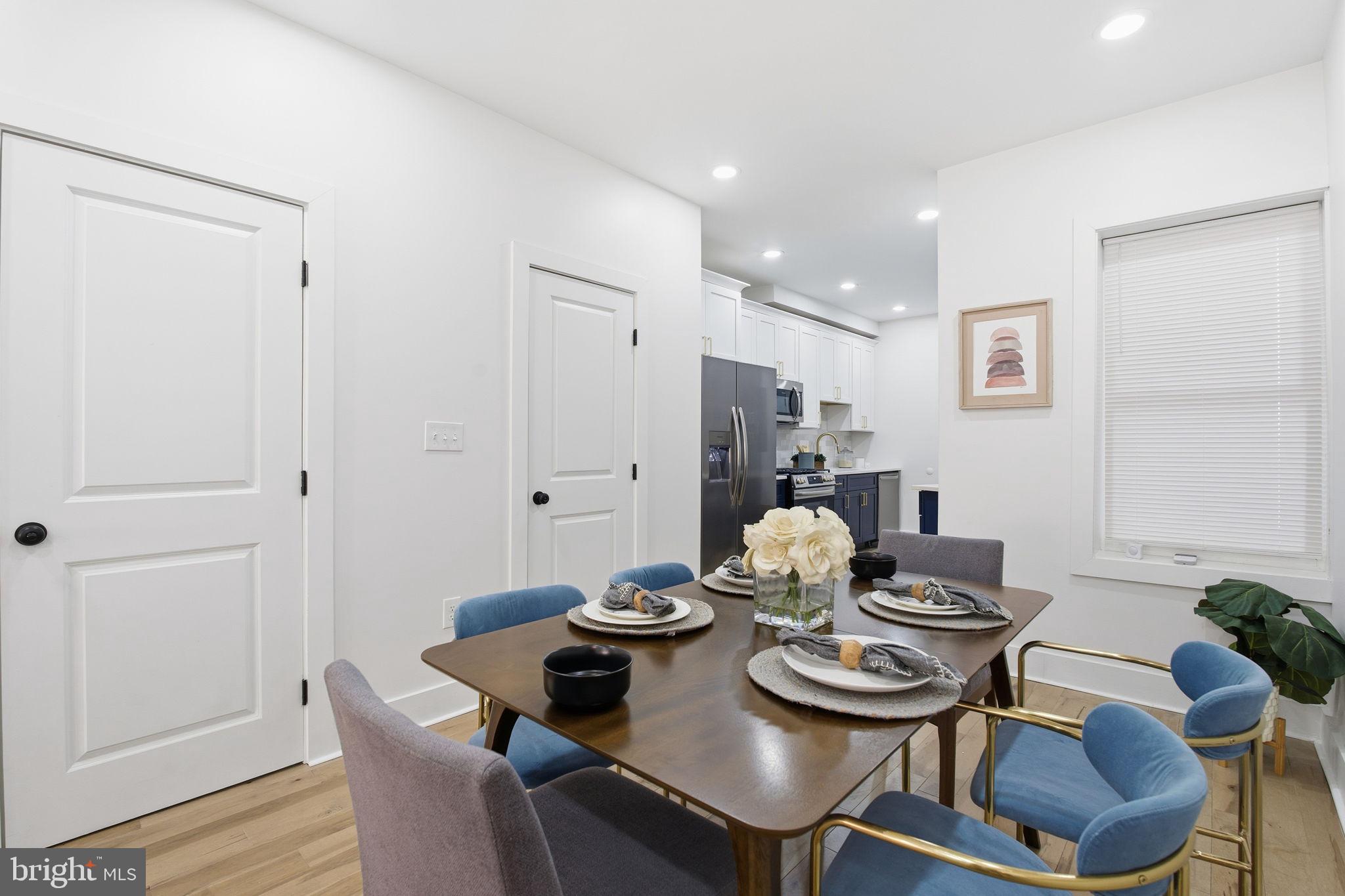 1742 East Oliver Street Baltimore, MD 21213 - Photo 5 of 36 a view of a dining room with furniture and wooden floor