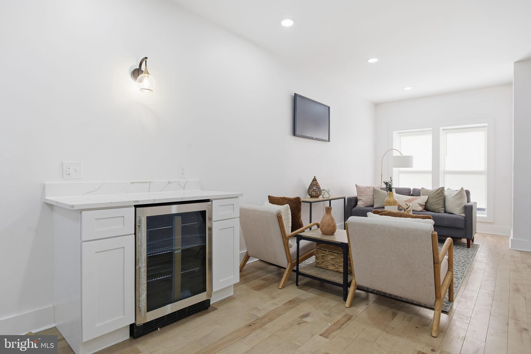 1742 East Oliver Street Baltimore, MD 21213 - Photo 6 of 36 a living room with furniture and a window