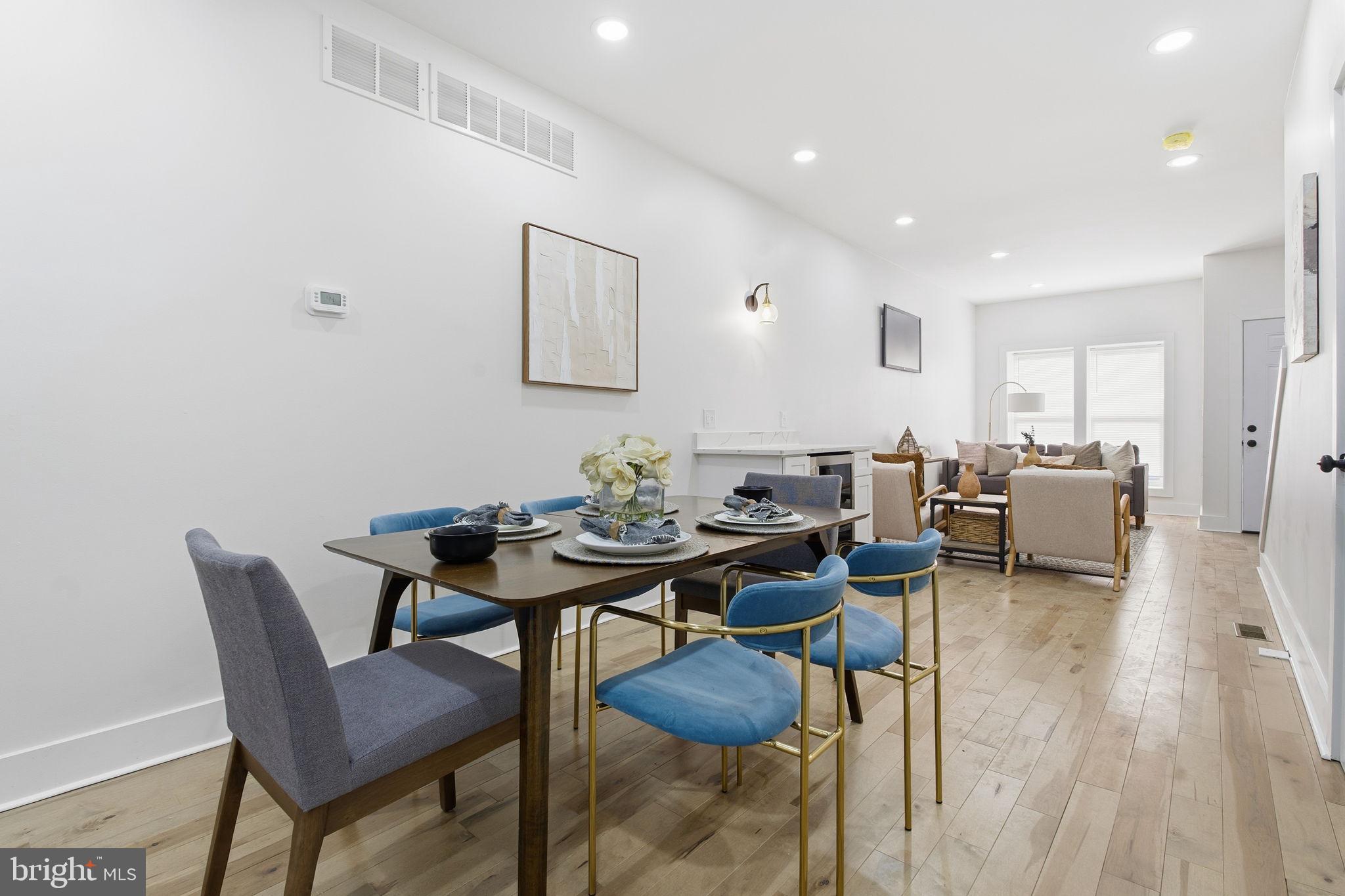 1742 East Oliver Street Baltimore, MD 21213 - Photo 8 of 36 a view of a livingroom and dining room