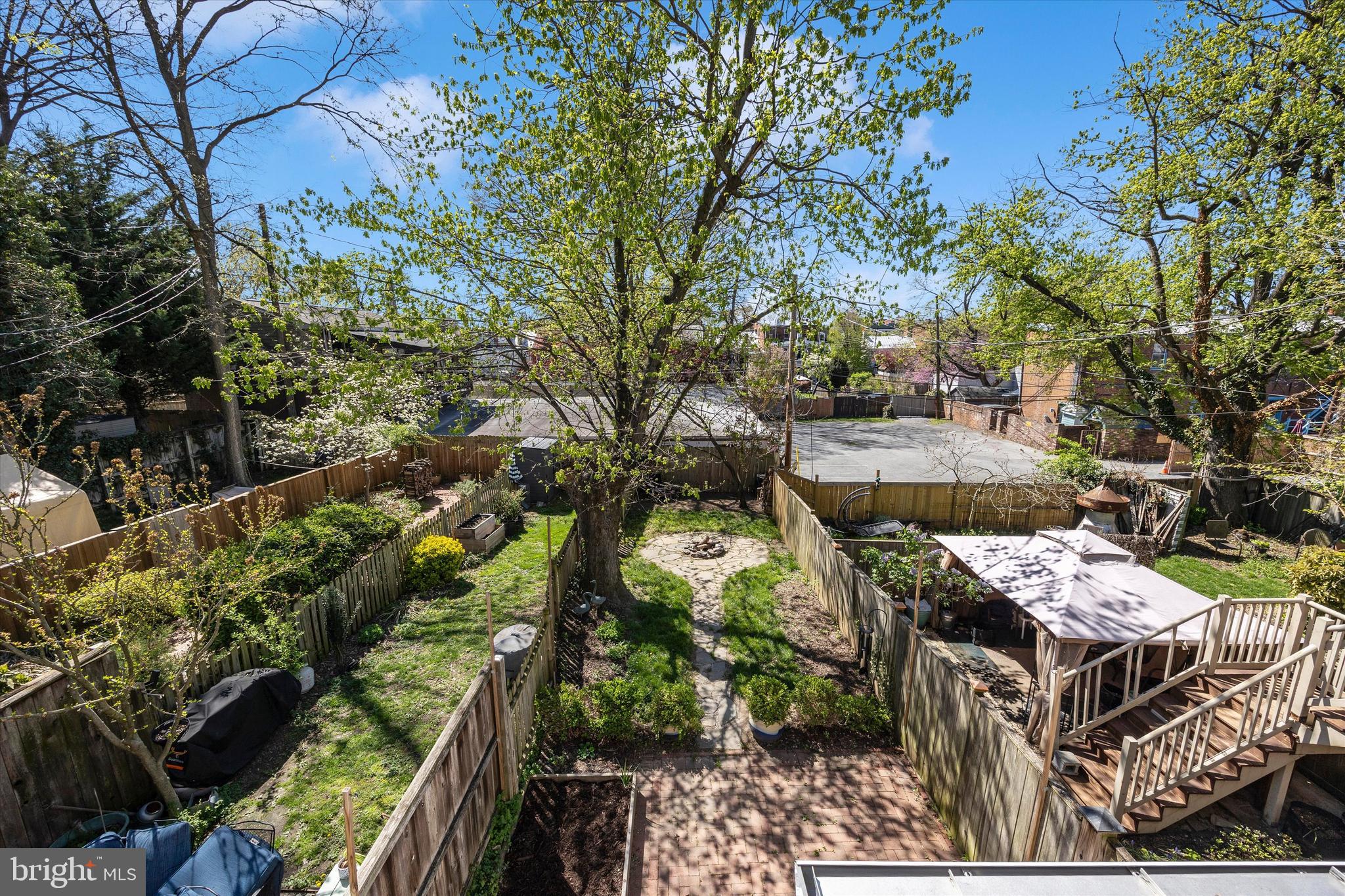 20 East 4th Street Frederick, MD 21701 - Photo 14 of 55 a view of a patio with table and chairs with wooden fence and plants