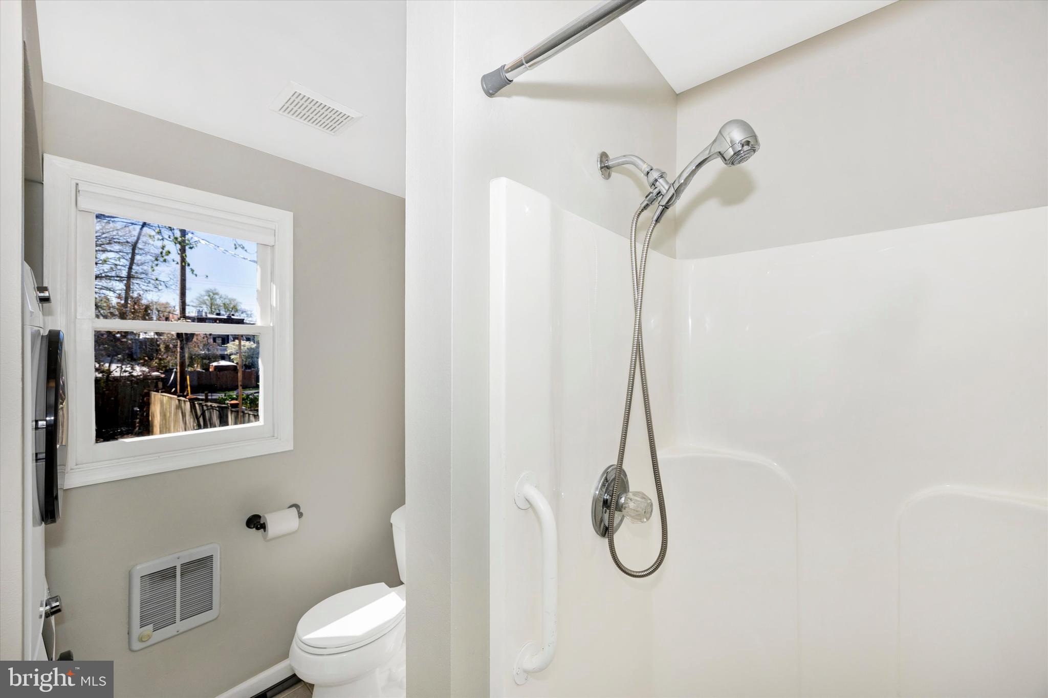 20 East 4th Street Frederick, MD 21701 - Photo 18 of 55 a bathroom with a shower a toilet and a sink