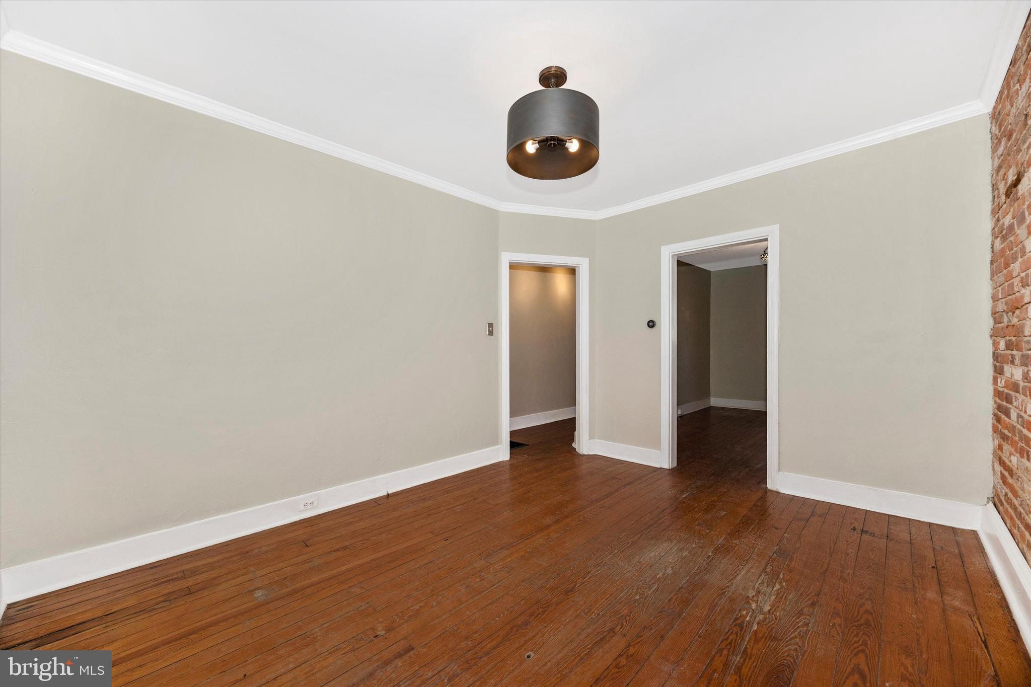20 East 4th Street Frederick, MD 21701 - Photo 31 of 55 an empty room with wooden floor and windows
