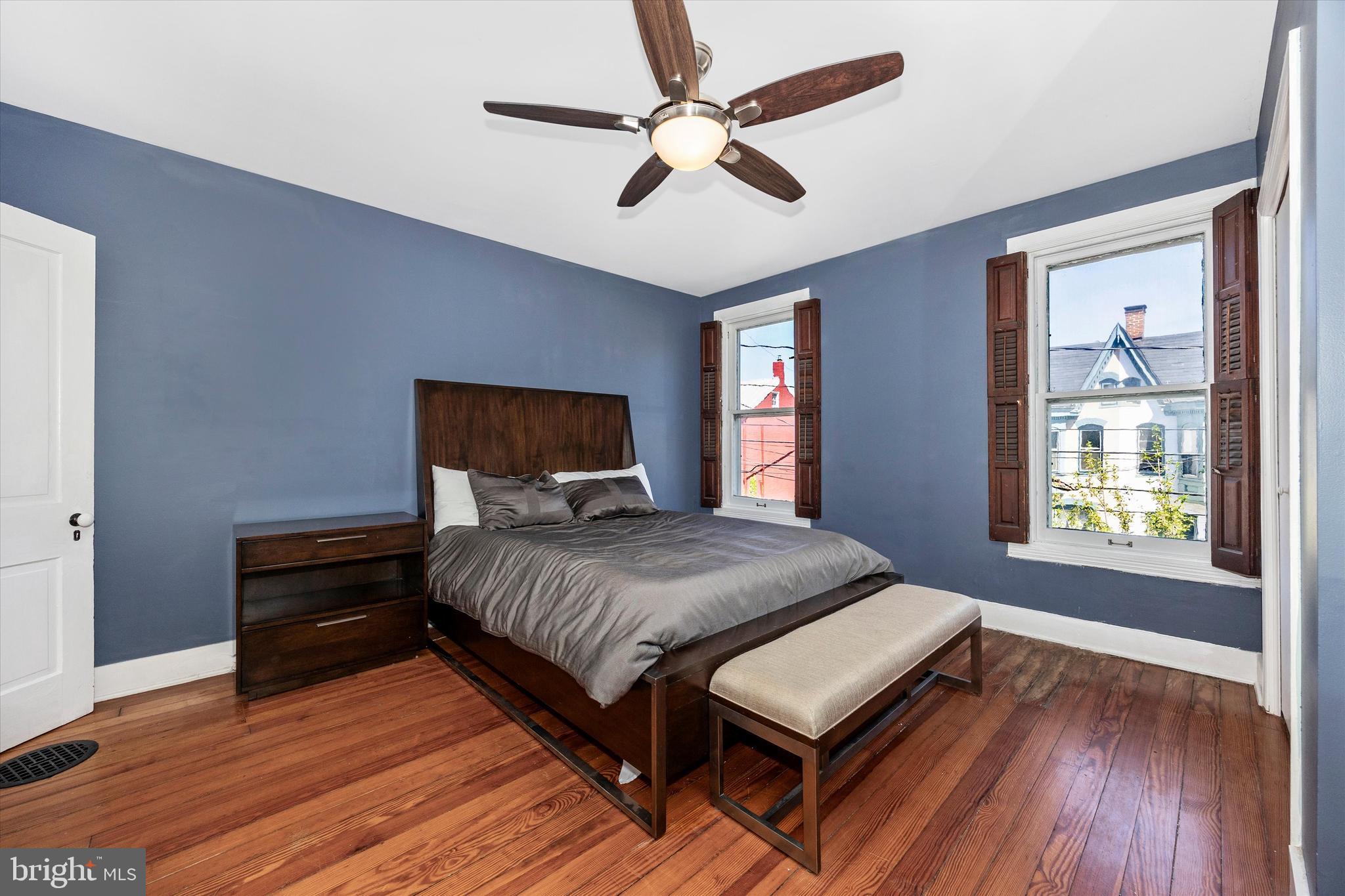 20 East 4th Street Frederick, MD 21701 - Photo 38 of 55 a bedroom with a bed and wooden floor