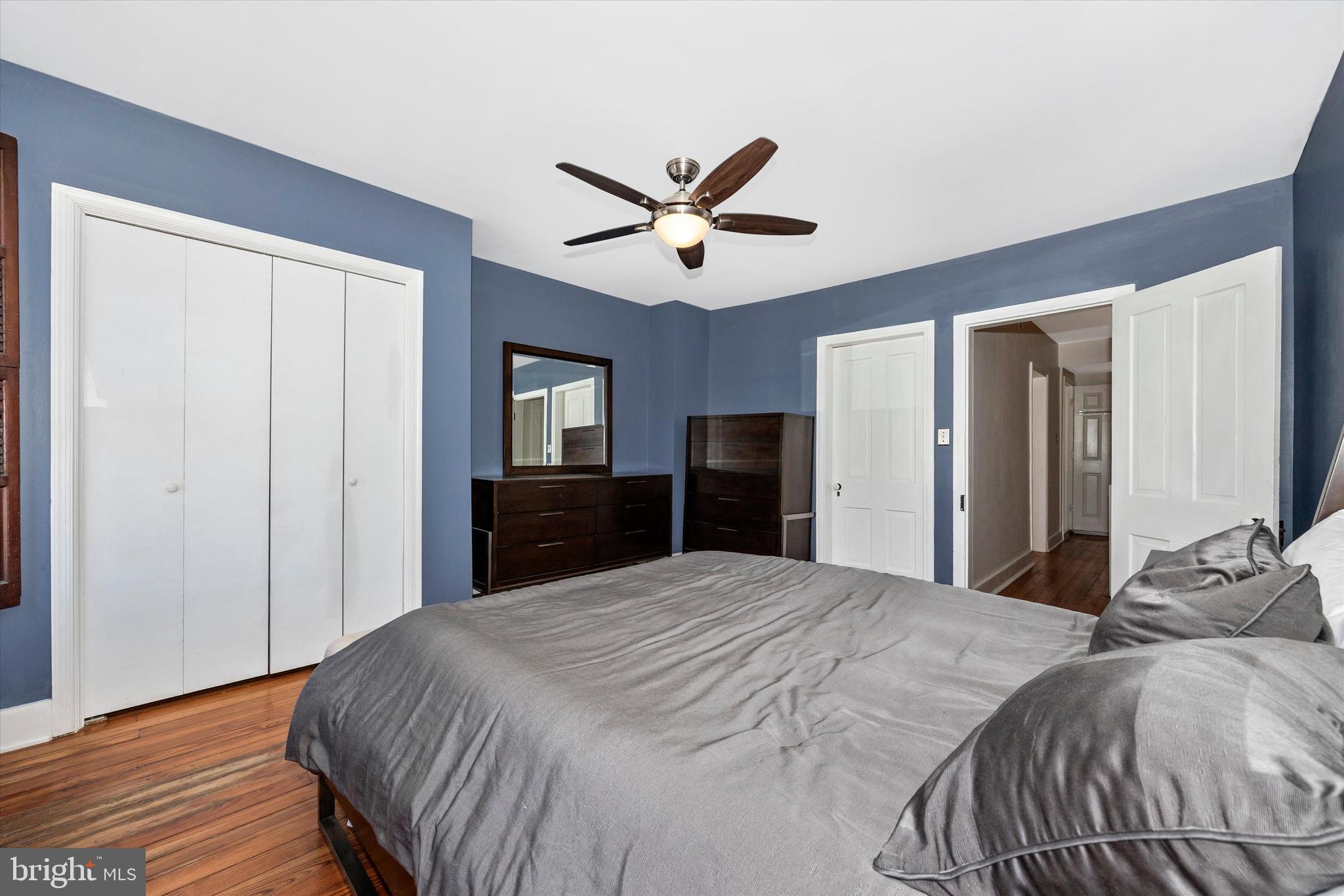 20 East 4th Street Frederick, MD 21701 - Photo 40 of 55 a bedroom with a large bed and a chandelier