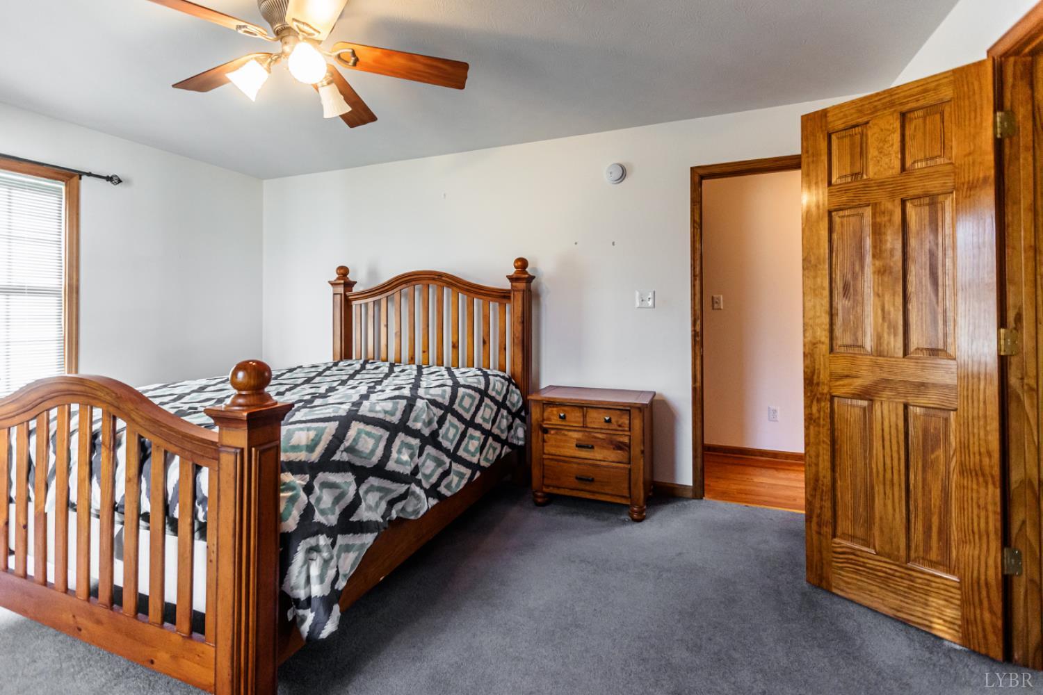 1975 Morning Star Road Appomattox, VA 24522 - Photo 19 of 29 a bedroom with a bed and a chandelier