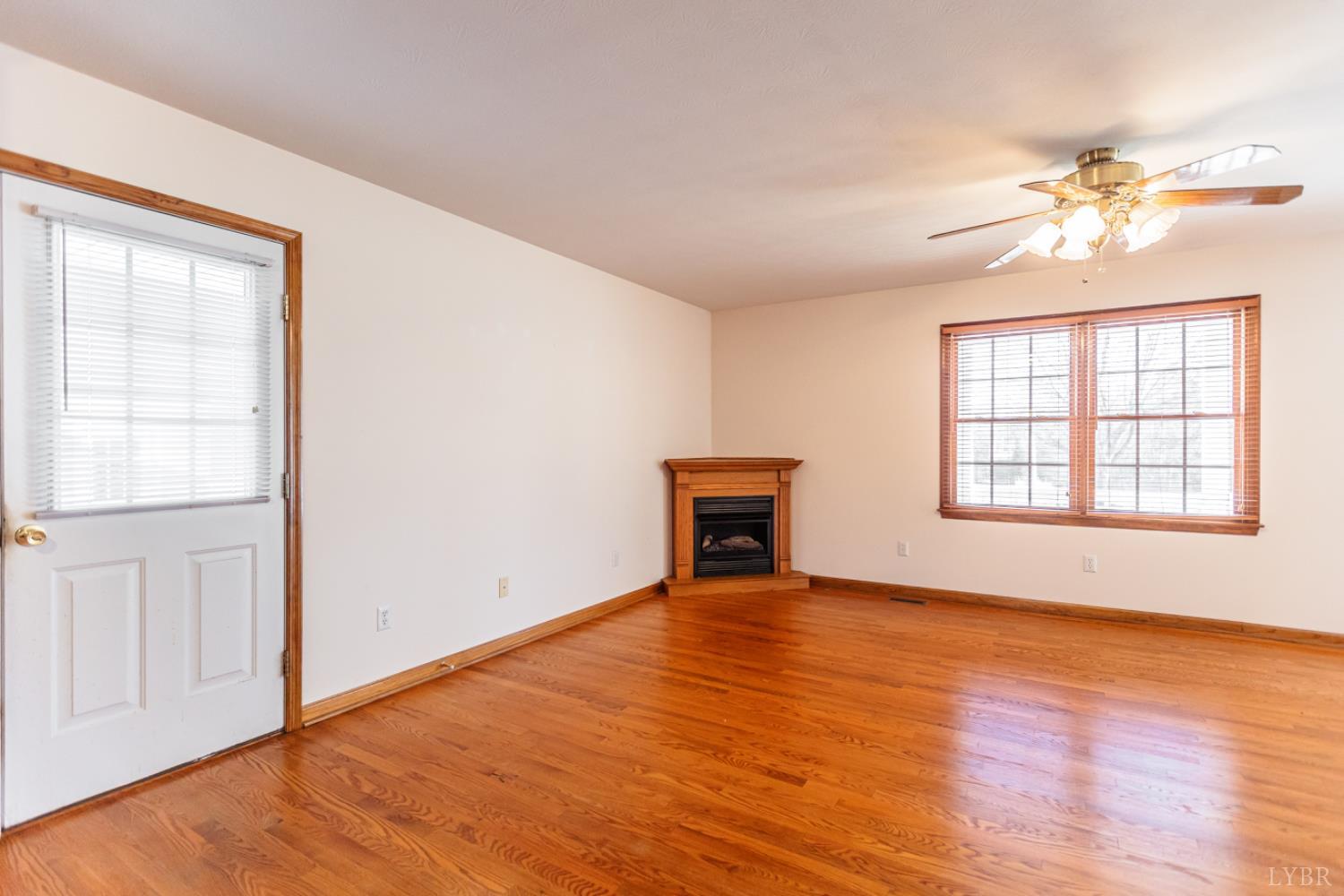 1975 Morning Star Road Appomattox, VA 24522 - Photo 10 of 29 a view of an empty room with a window and wooden floor