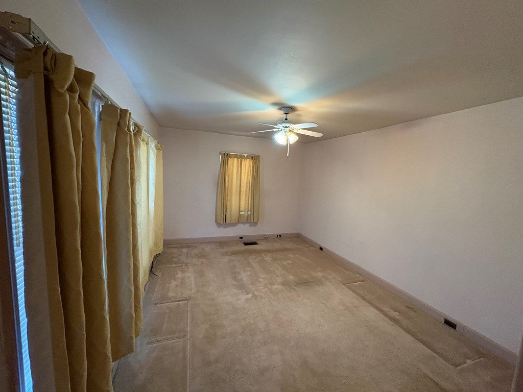 2534 Cole Drive Columbus, GA 31906 - Photo 12 of 18 a view of an empty room with window and chandelier fan