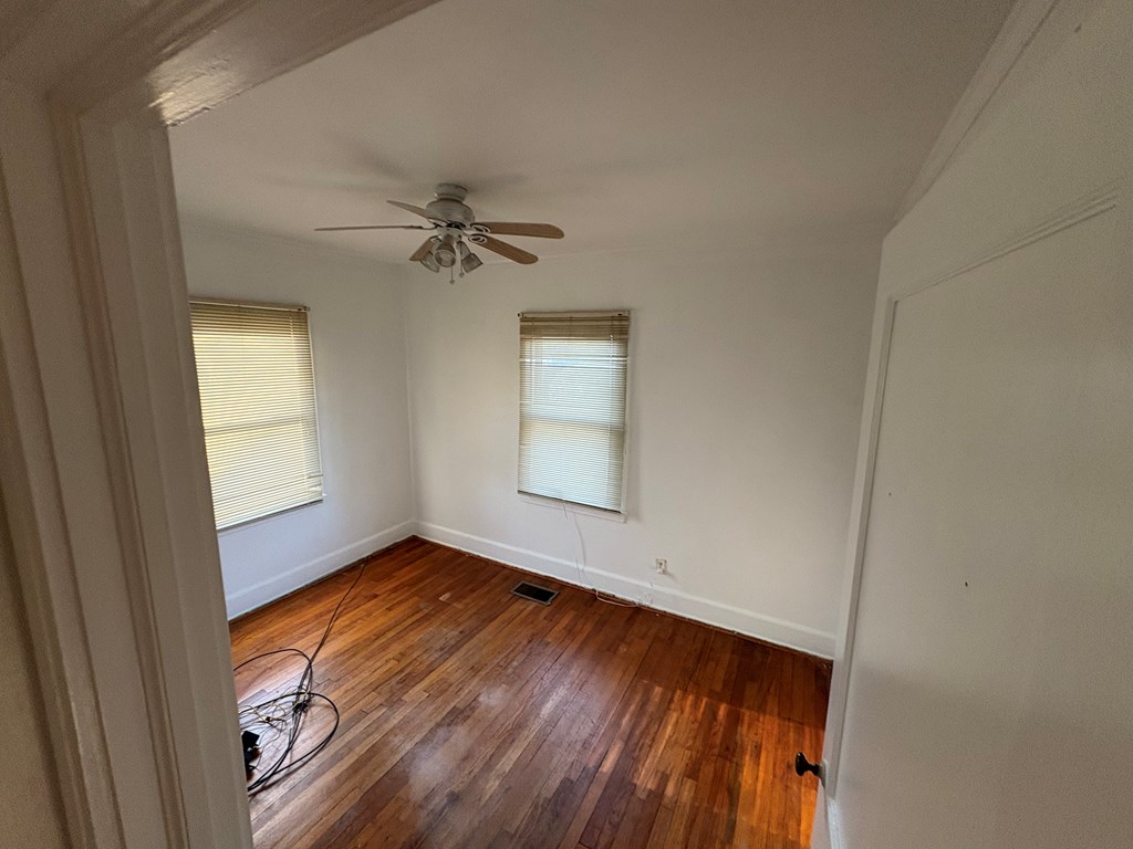 2534 Cole Drive Columbus, GA 31906 - Photo 13 of 18 an empty room with a window and a ceiling fan