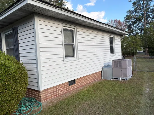a view of a back yard of the house