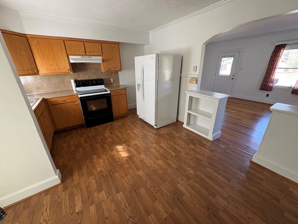 2534 Cole Drive Columbus, GA 31906 - Photo 6 of 18 a kitchen with a refrigerator and a stove top oven