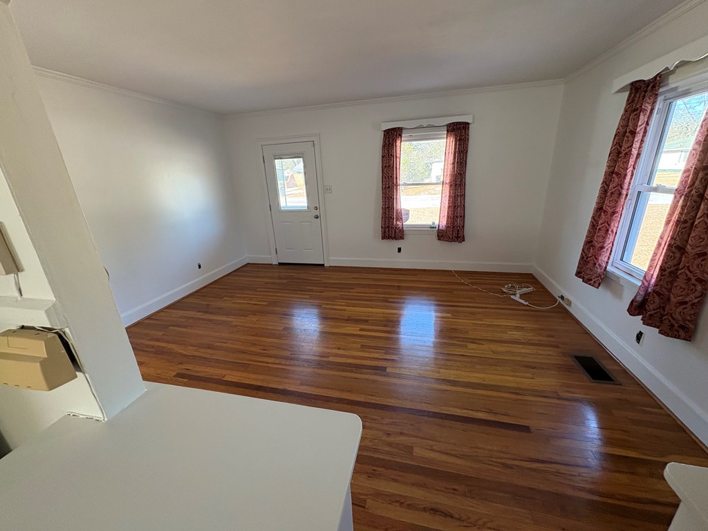 2534 Cole Drive Columbus, GA 31906 - Photo 9 of 18 a view of an empty room with wooden floor and a window