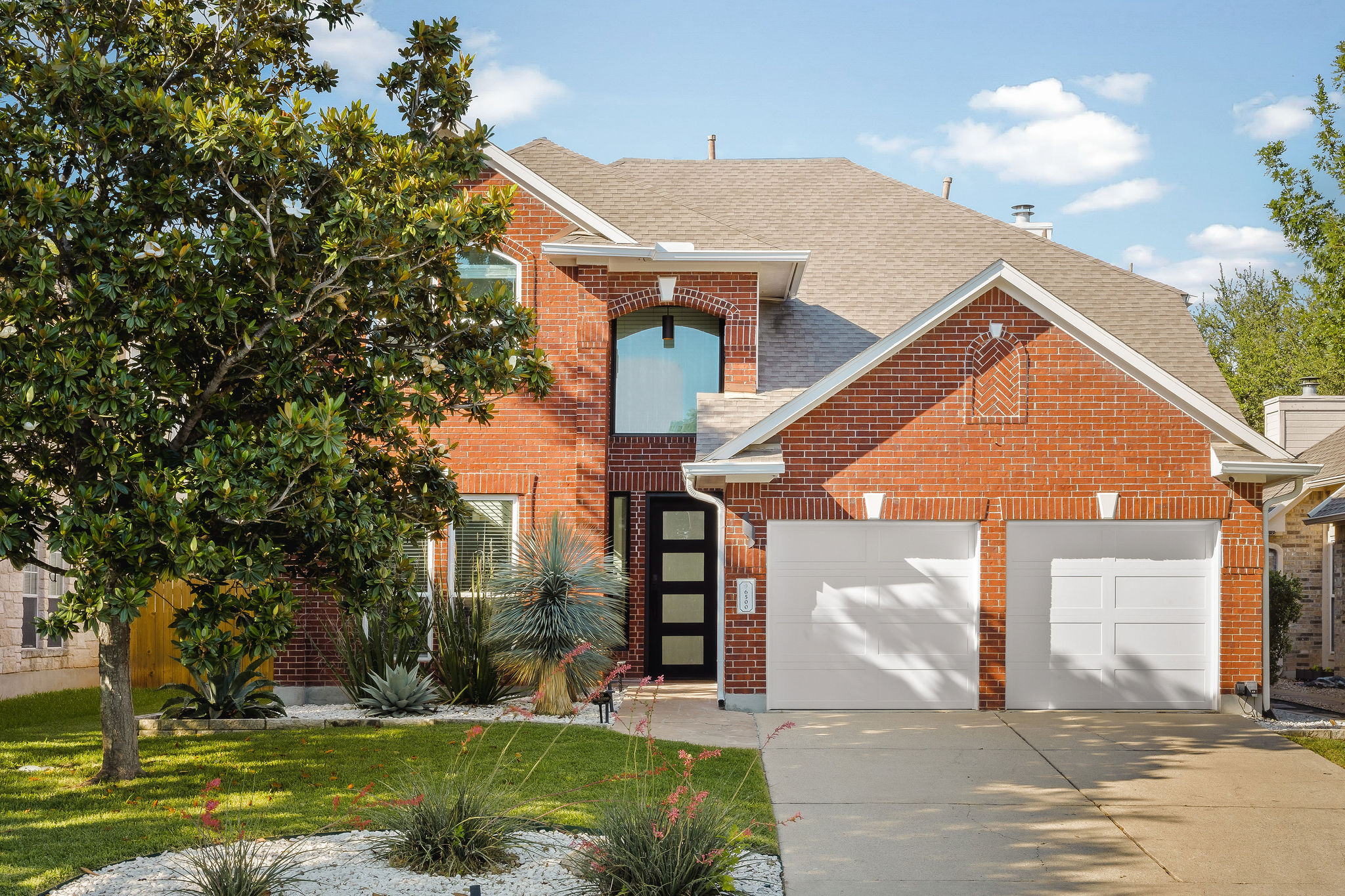 6500 Clay Allison Pass Austin, TX 78749 - Photo 1 of 39 Brick exterior with a prominent two-car garage