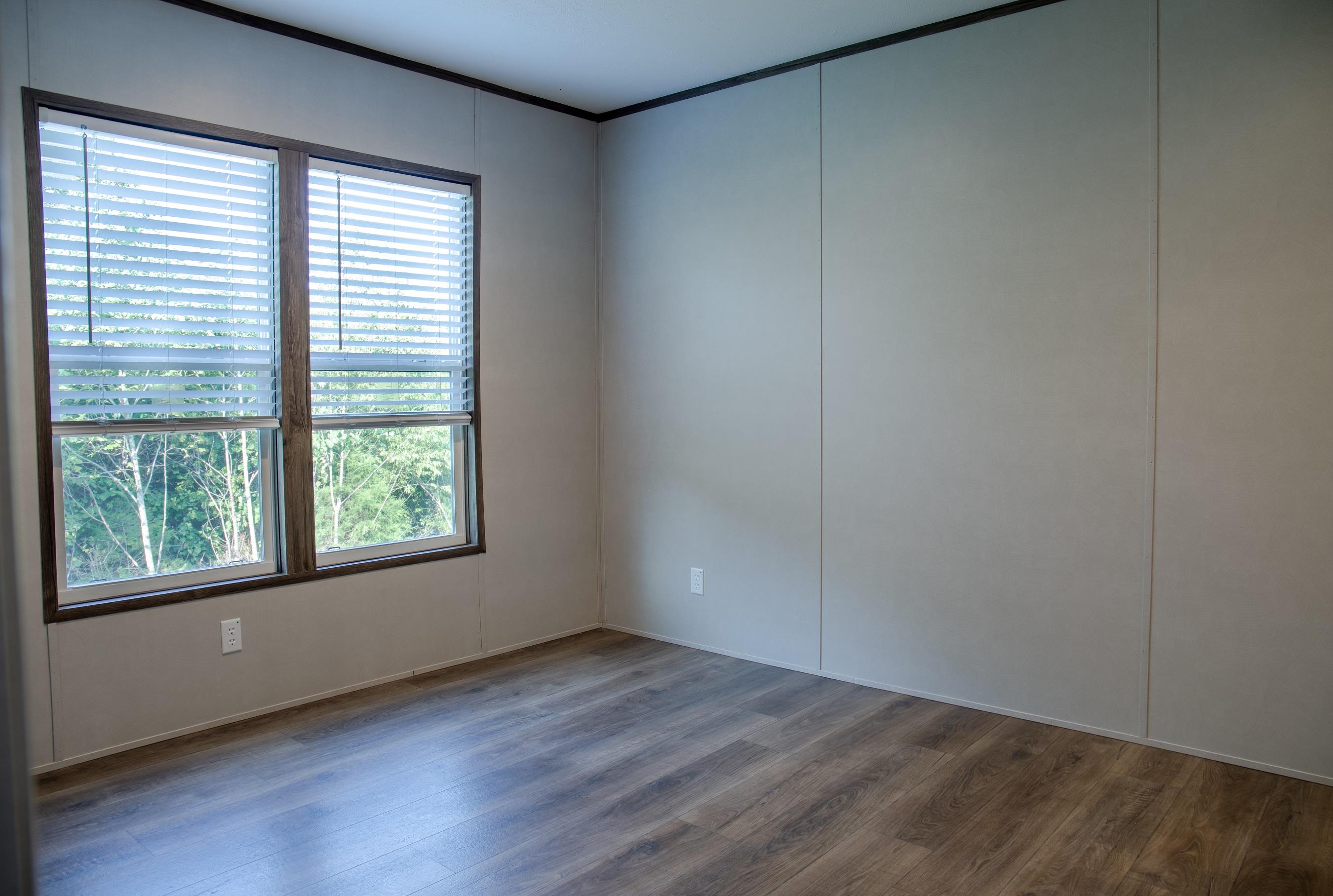7400 Hardy Road Hardy, VA 24101 - Photo 33 of 57 an empty room with wooden floor and windows