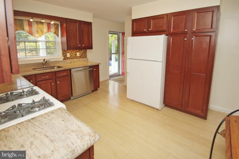 2 Lauer Terrace Silver Spring, MD 20901 - Photo 2 of 28 a kitchen with a refrigerator and a sink