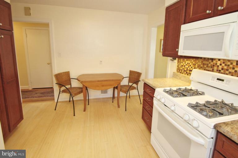 2 Lauer Terrace Silver Spring, MD 20901 - Photo 20 of 28 a kitchen with a stove and a table