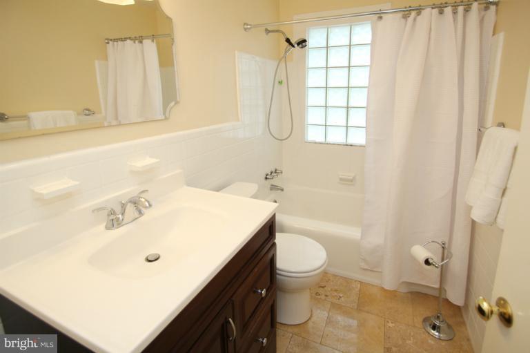 2 Lauer Terrace Silver Spring, MD 20901 - Photo 24 of 28 a bathroom with a sink a toilet and shower