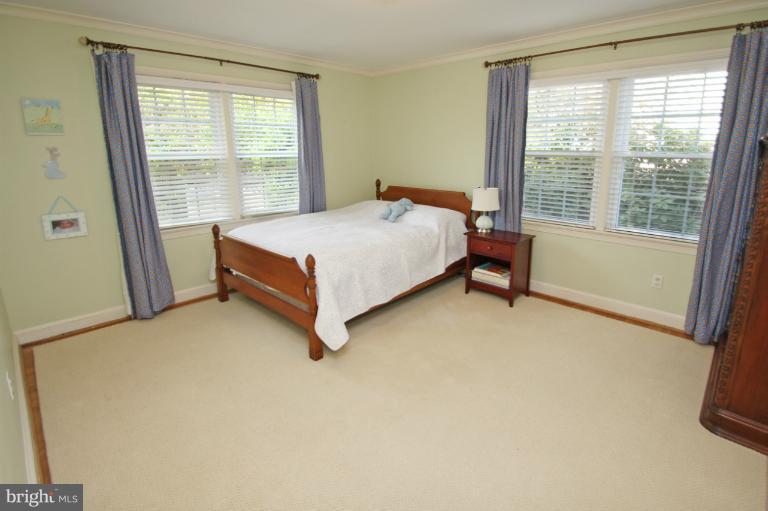 2 Lauer Terrace Silver Spring, MD 20901 - Photo 4 of 28 a bed sitting in a room next to a window