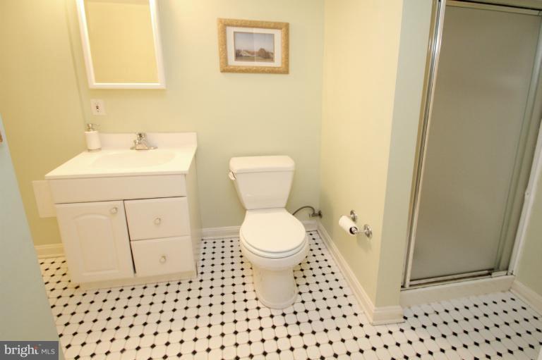 2 Lauer Terrace Silver Spring, MD 20901 - Photo 6 of 28 a bathroom with a toilet a sink and a mirror