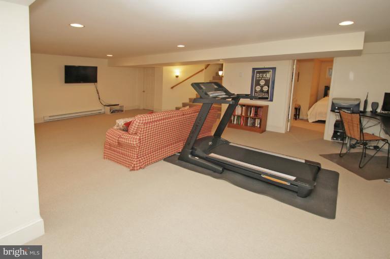 2 Lauer Terrace Silver Spring, MD 20901 - Photo 8 of 28 a room with gym equipment and a flat screen tv
