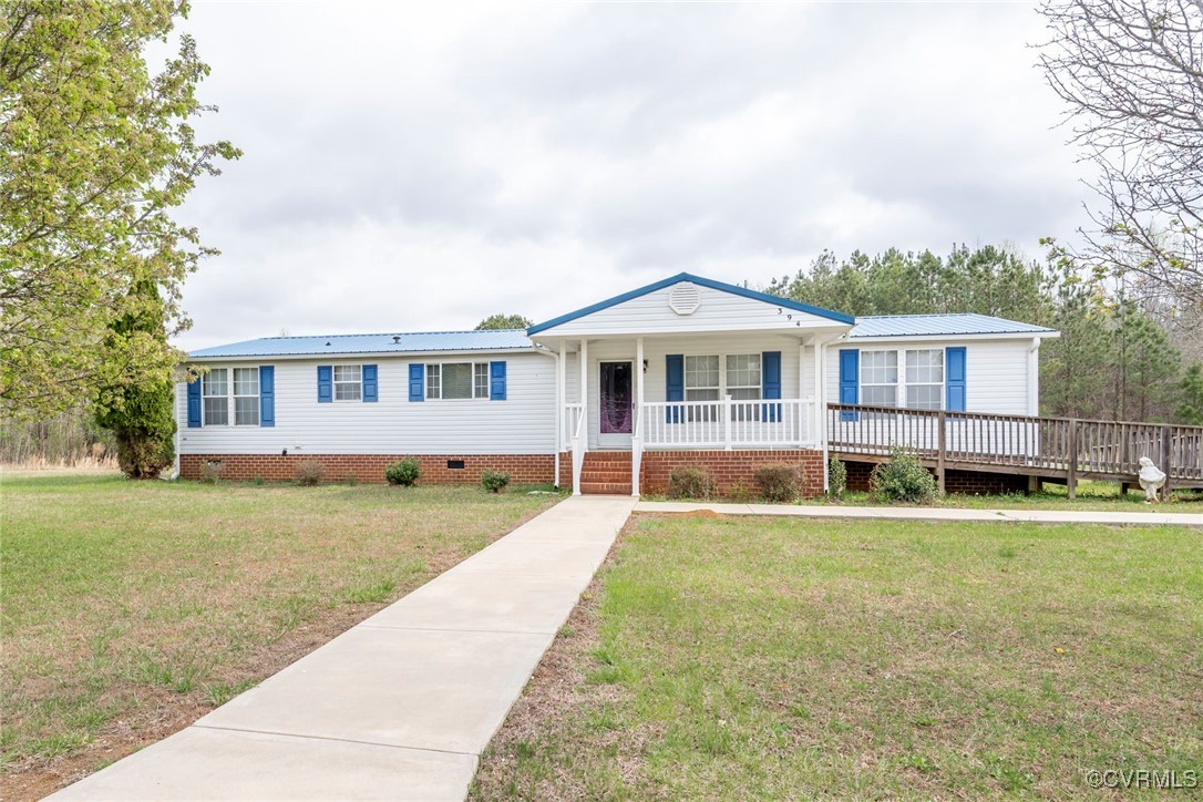 a view of a house with a swimming pool and a yard
