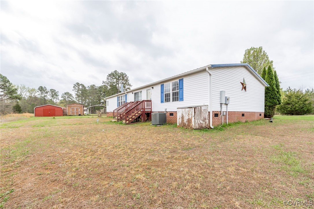 394 Tower Road Brodnax, VA 23920 - Photo 24 of 34 a view of a house with backyard and garden