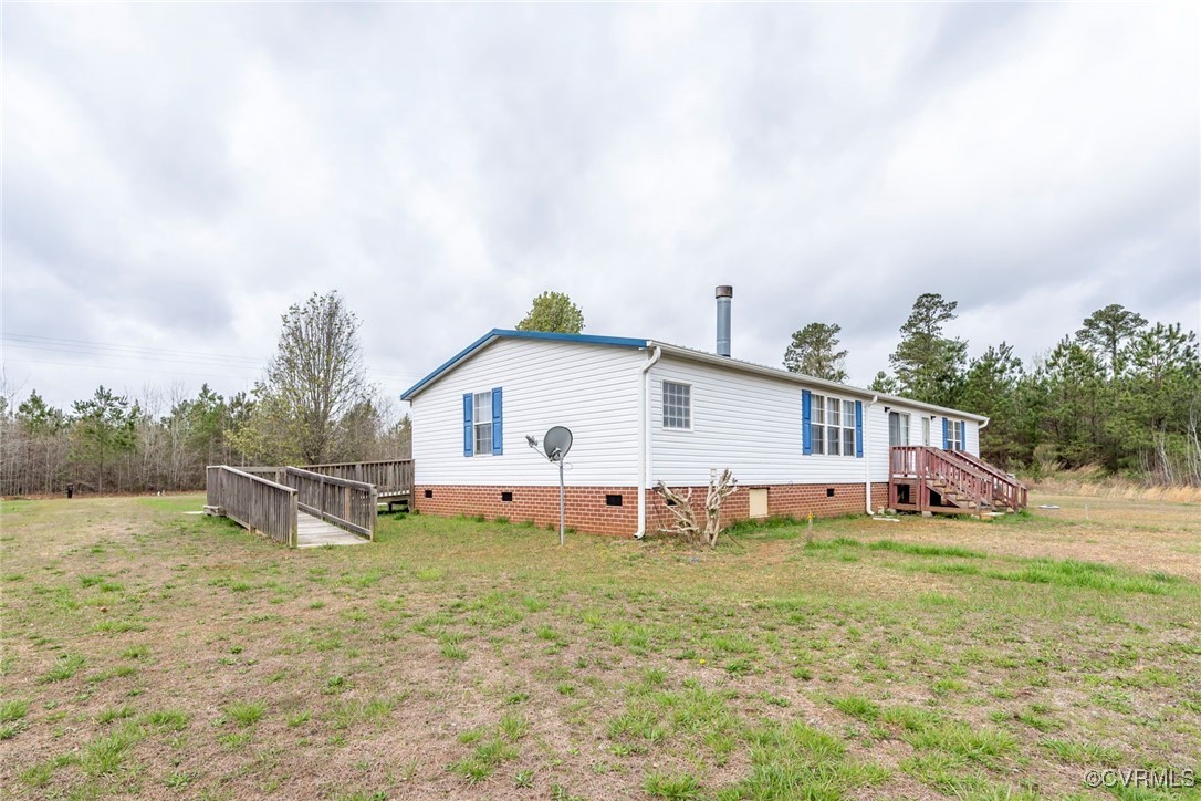 394 Tower Road Brodnax, VA 23920 - Photo 25 of 34 a view of a house with a yard and sitting area