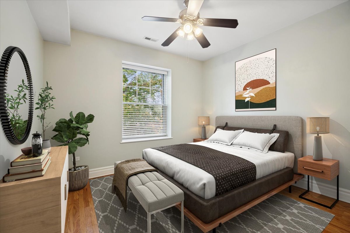 1265 West Granville Avenue, Unit 3 Chicago, IL 60660 - Photo 13 of 15 a bedroom with a bed and a painting on the wall