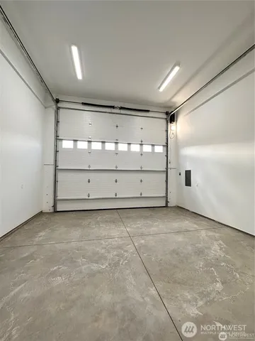 a bed room with a bed and gym machine