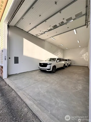 a view of garage with parked cars