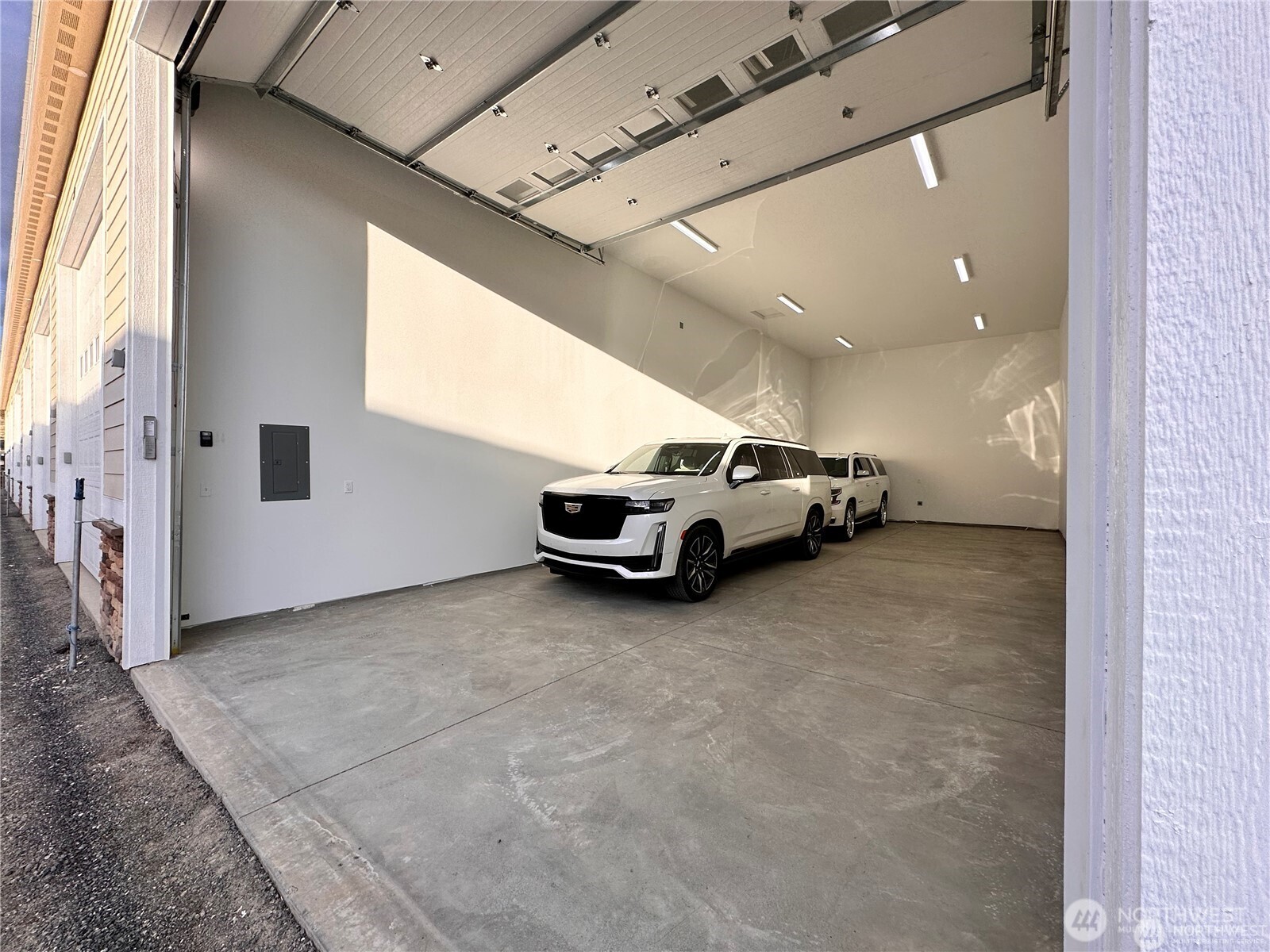 9842 West 9th Road Northwest, Unit A4 Quincy, WA 98848 - Photo 7 of 15 a view of garage with parked cars