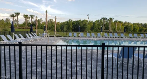a view of a balcony with yard