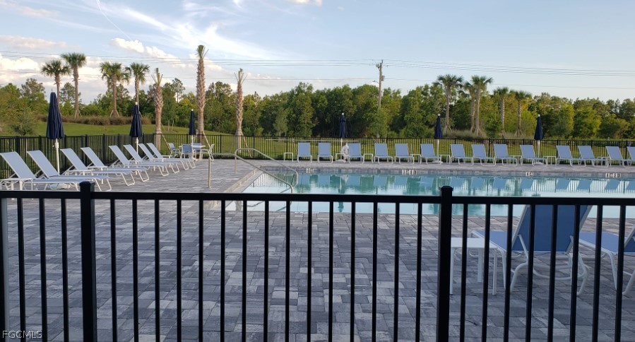 12312 Amber Waves Road Lehigh Acres, FL 33974 - Photo 29 of 32 a view of a balcony with yard