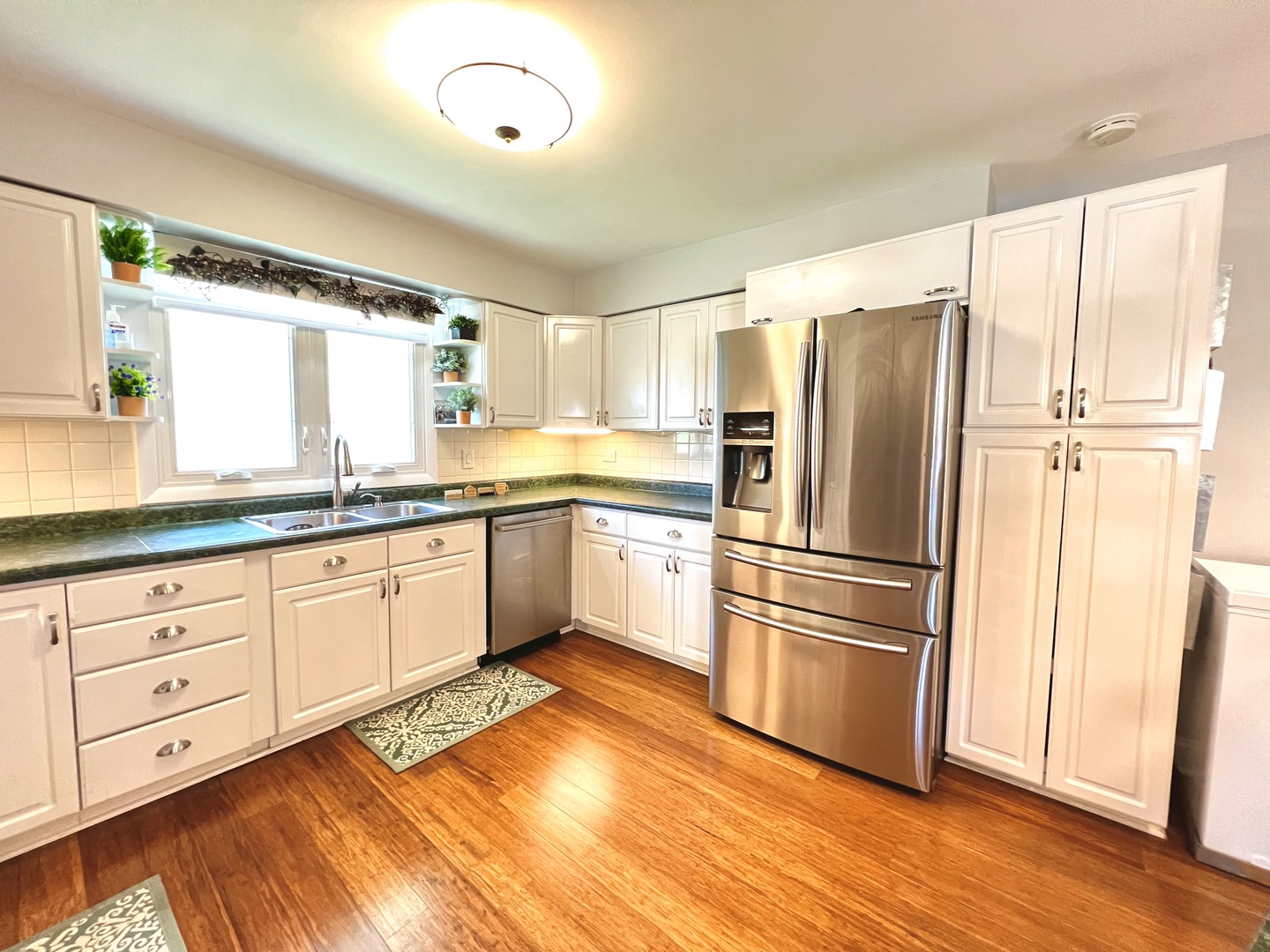 7125 Wirth Drive Darien, IL 60561 - Photo 11 of 38 a kitchen with granite countertop stainless steel appliances a refrigerator sink and microwave