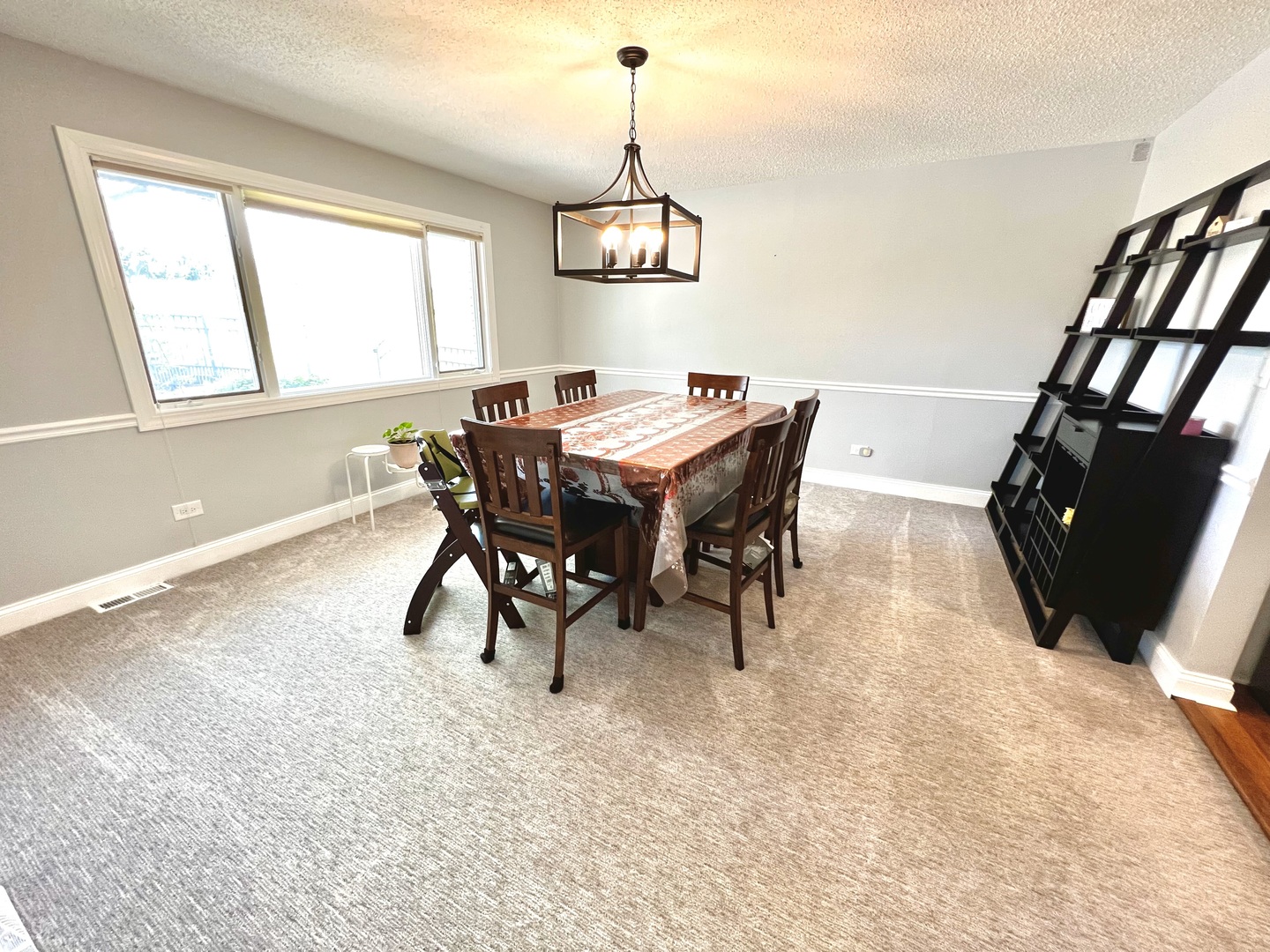 7125 Wirth Drive Darien, IL 60561 - Photo 15 of 38 a view of a dining room with furniture window and wooden floor