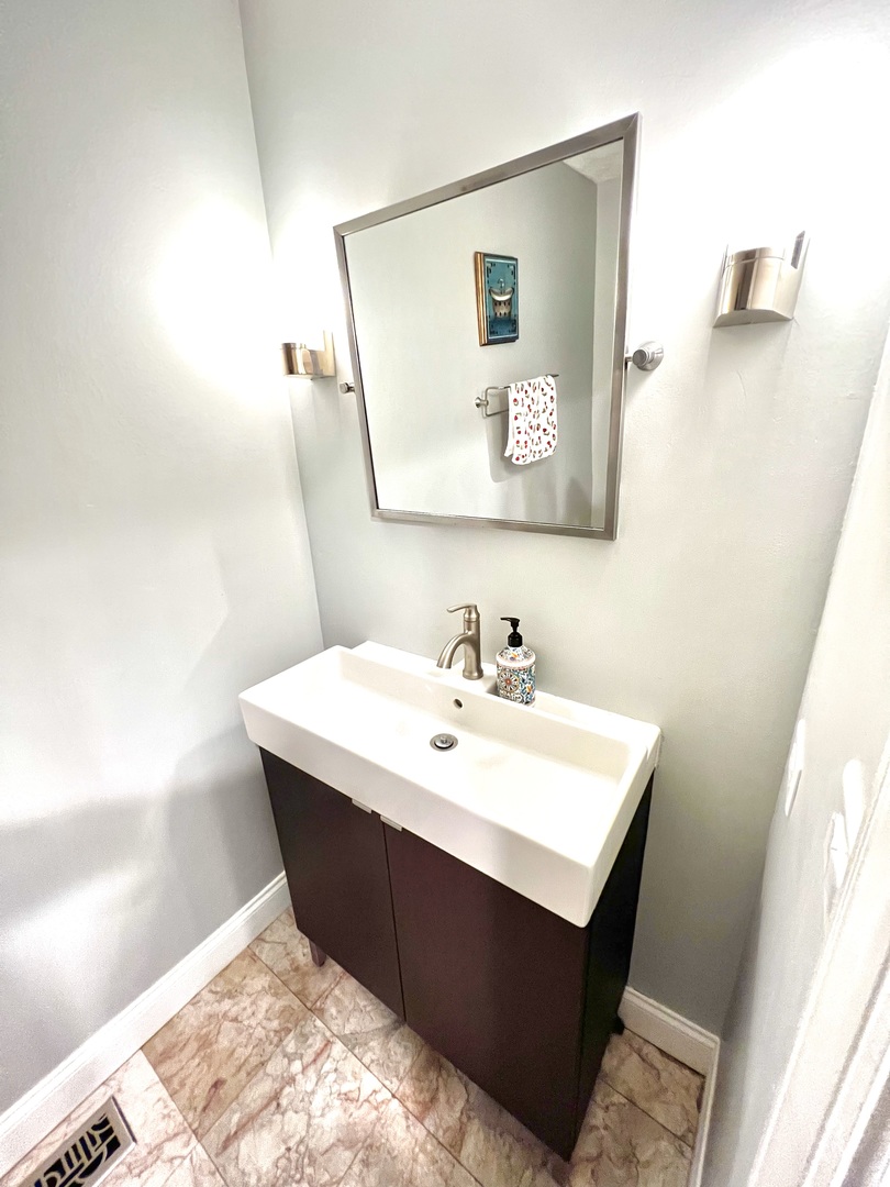 7125 Wirth Drive Darien, IL 60561 - Photo 19 of 38 a bathroom with a sink mirror and vanity