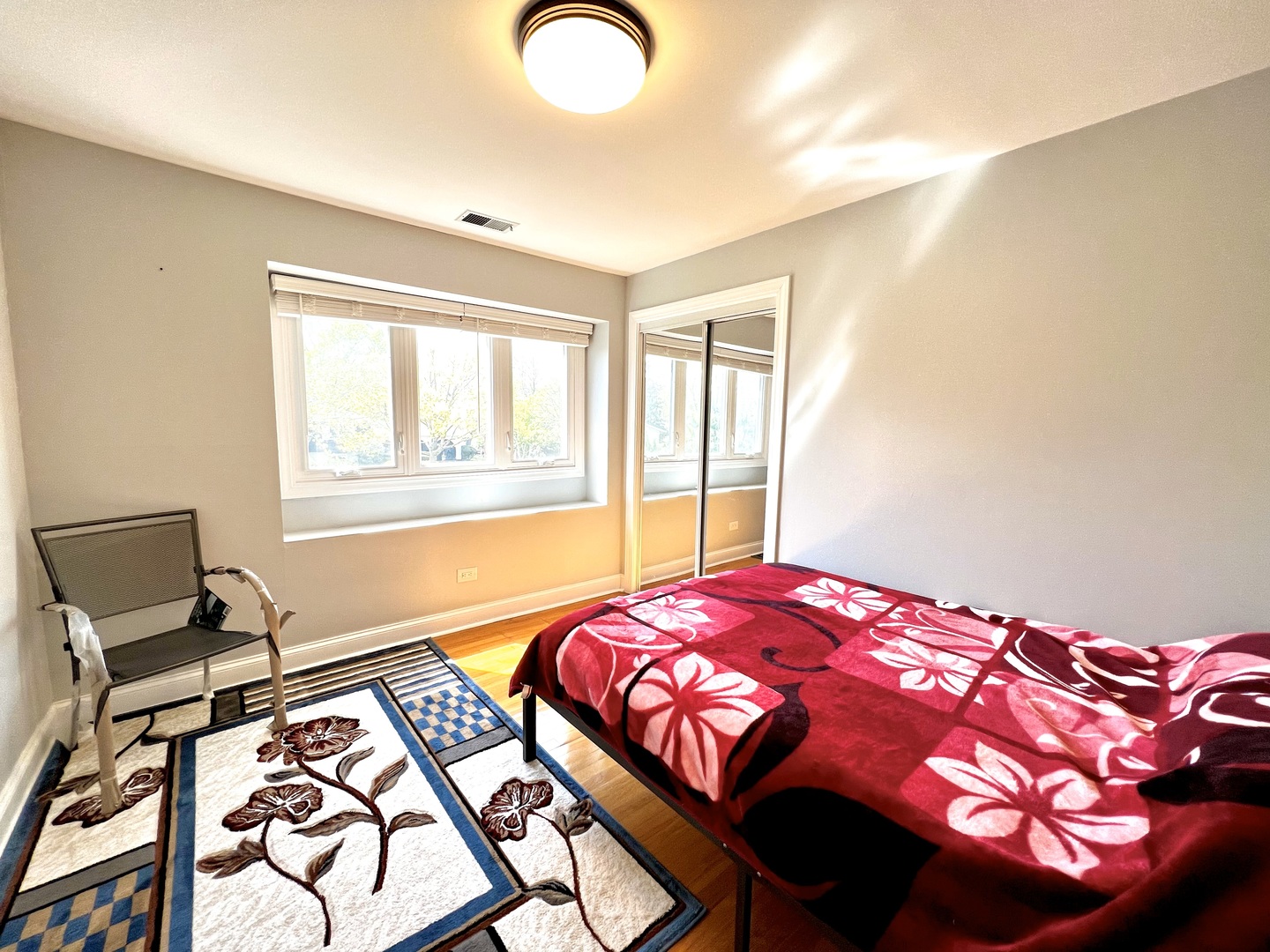 7125 Wirth Drive Darien, IL 60561 - Photo 24 of 38 a bedroom with a bed and dresser with windows