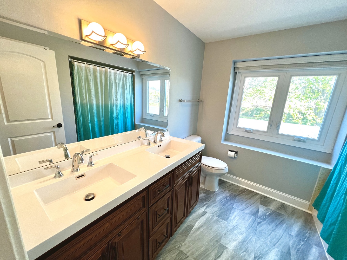 7125 Wirth Drive Darien, IL 60561 - Photo 28 of 38 a bathroom with a double vanity sink toilet and a mirror