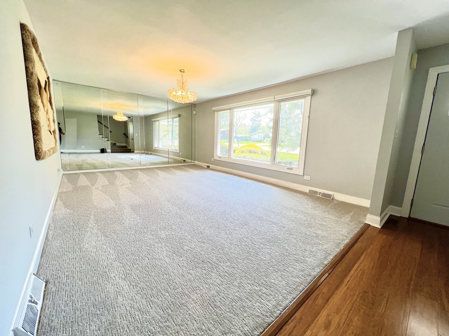 7125 Wirth Drive Darien, IL 60561 - Photo 8 of 38 an empty room with wooden floor and windows
