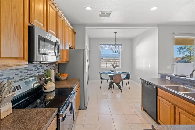 a kitchen with lots of counter space and appliances