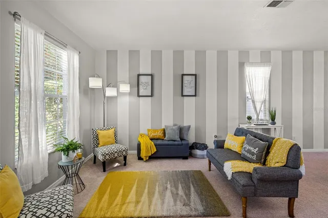 a dining room with furniture and window