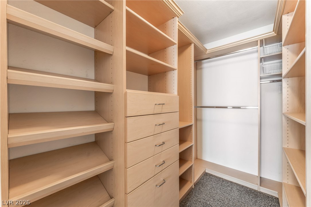 1901 Rio Canyon Court, Unit 102 Las Vegas, NV 89128 - Photo 13 of 23 Optimized closet system with abundant shelving and built-in drawers.