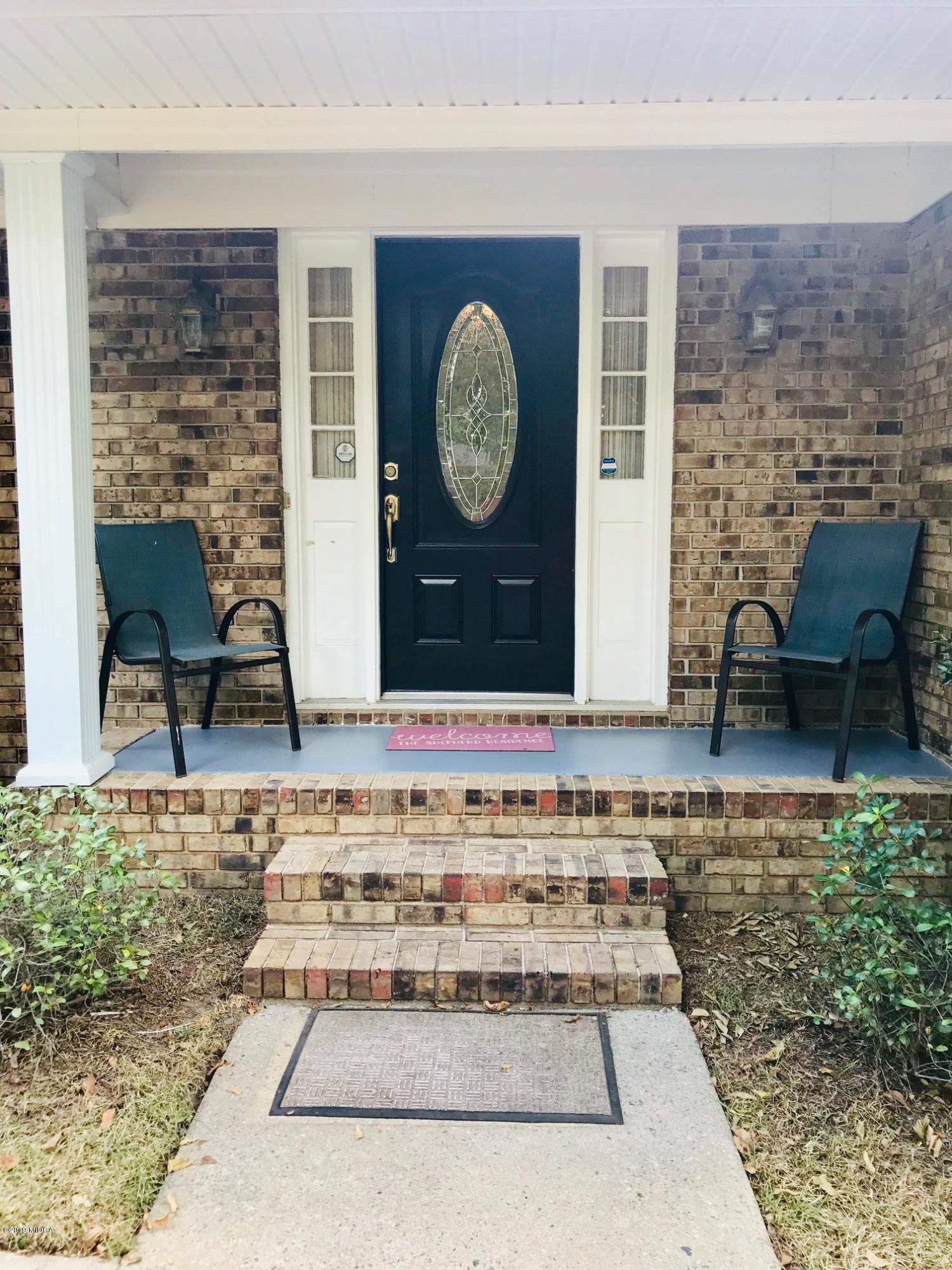 5838 School Road Macon, GA 31216 - Photo 2 of 33 a living room with a rug a chair and a table