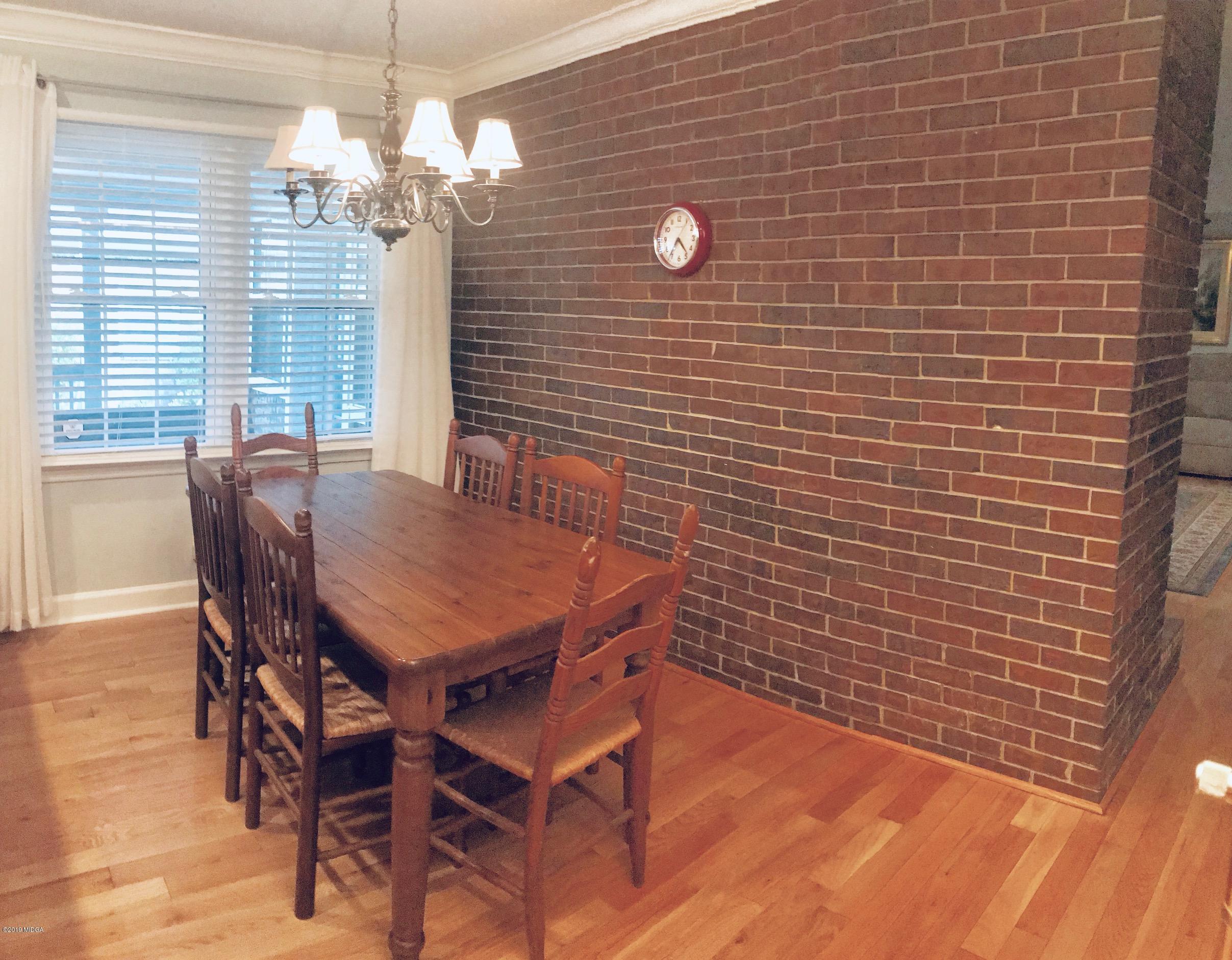 5838 School Road Macon, GA 31216 - Photo 16 of 33 a view of a dining room with furniture and chandelier