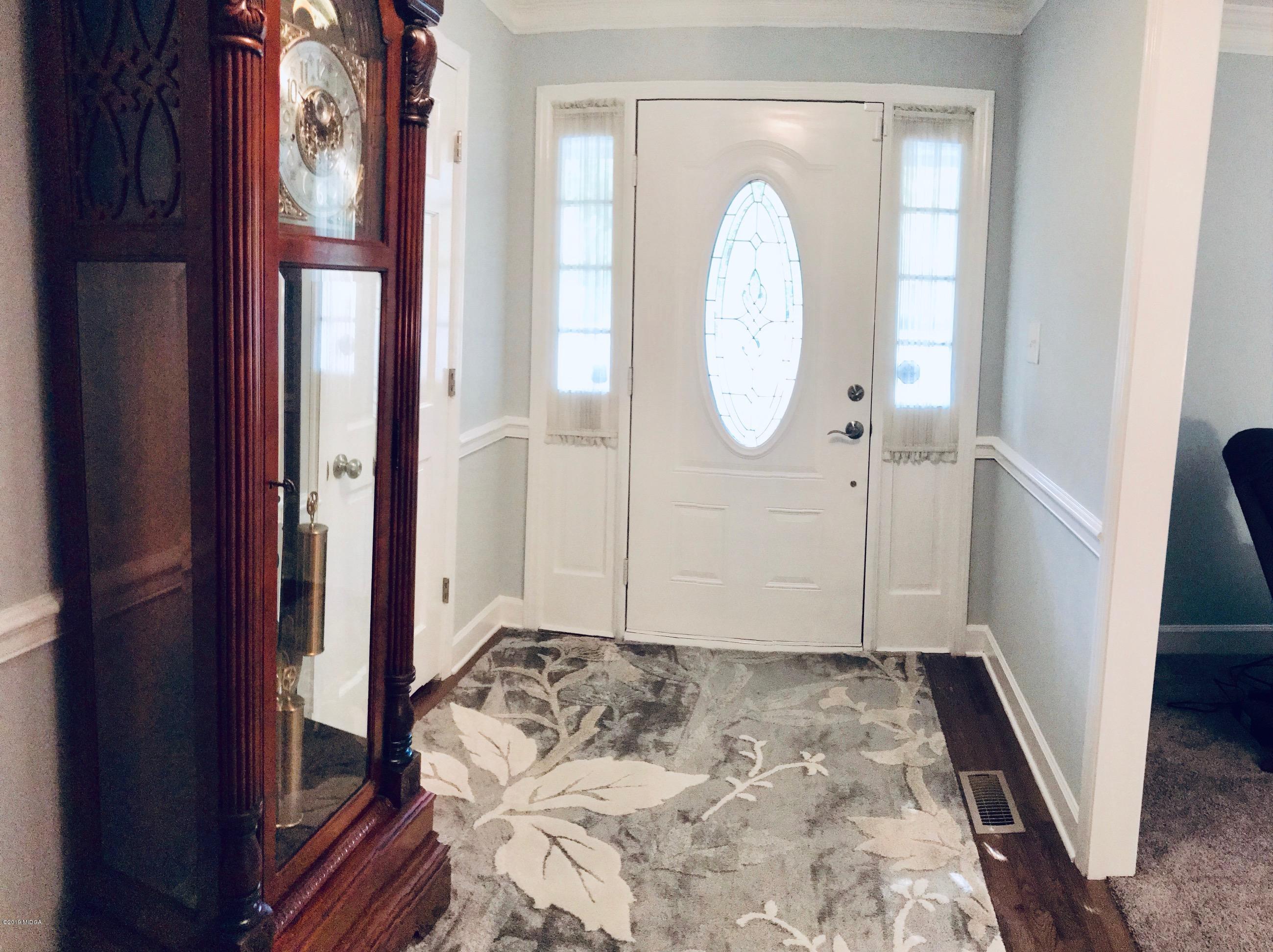 5838 School Road Macon, GA 31216 - Photo 3 of 33 a view of a livingroom with wooden floor and entryway