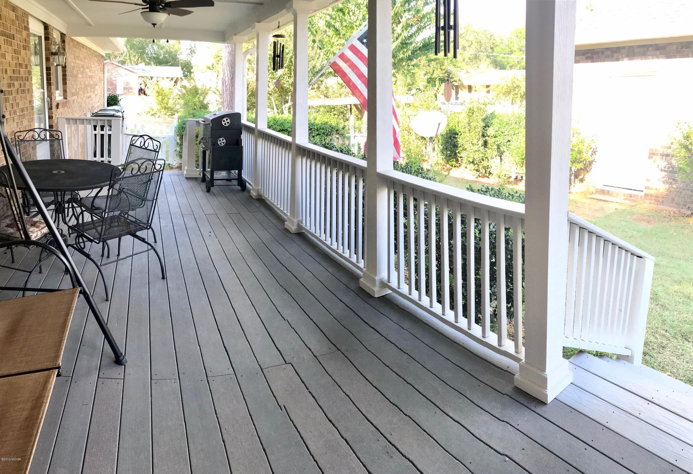 5838 School Road Macon, GA 31216 - Photo 21 of 33 a view of a balcony with chairs and wooden floor