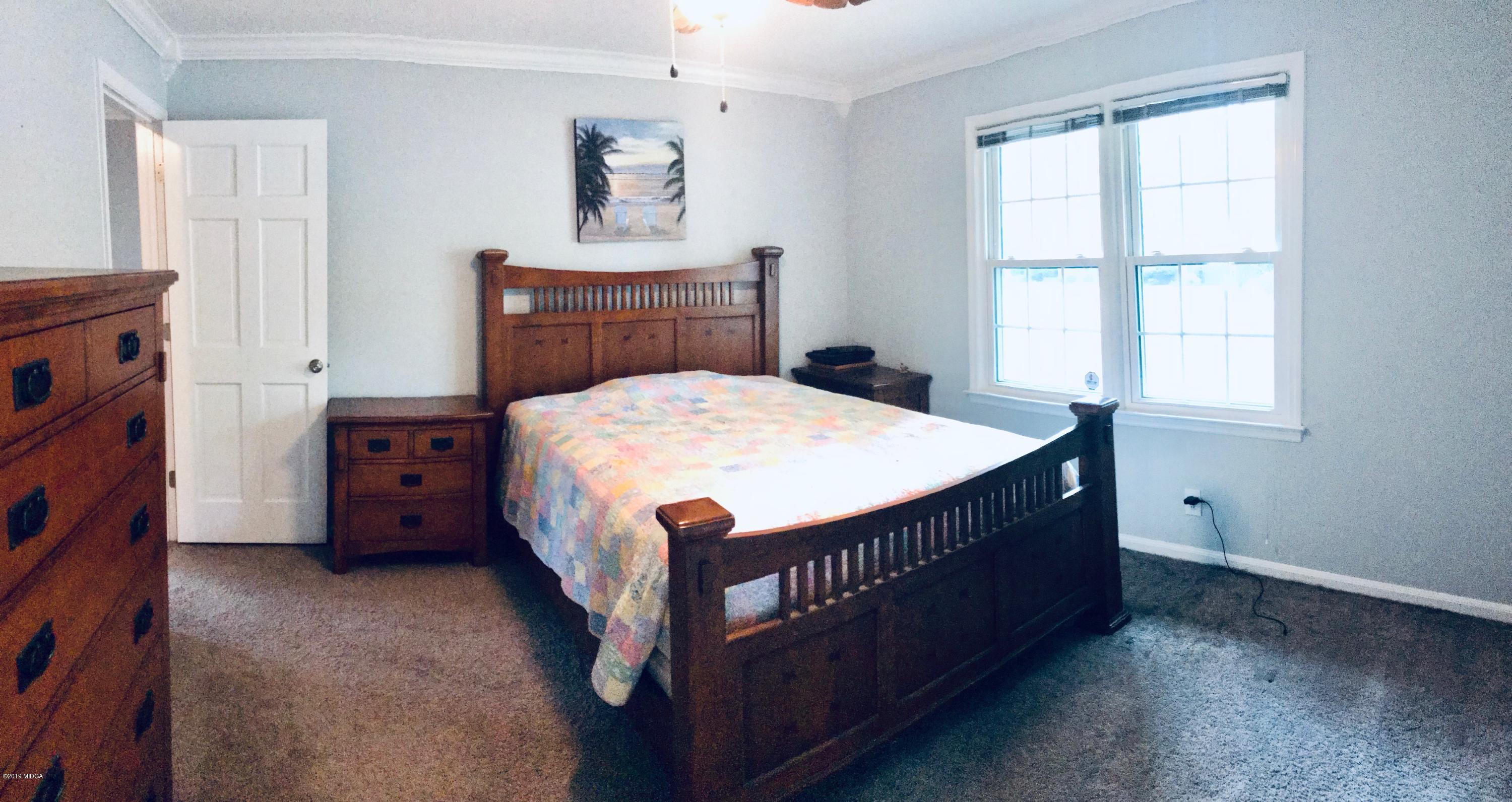5838 School Road Macon, GA 31216 - Photo 24 of 33 a bed room with a bed and a window