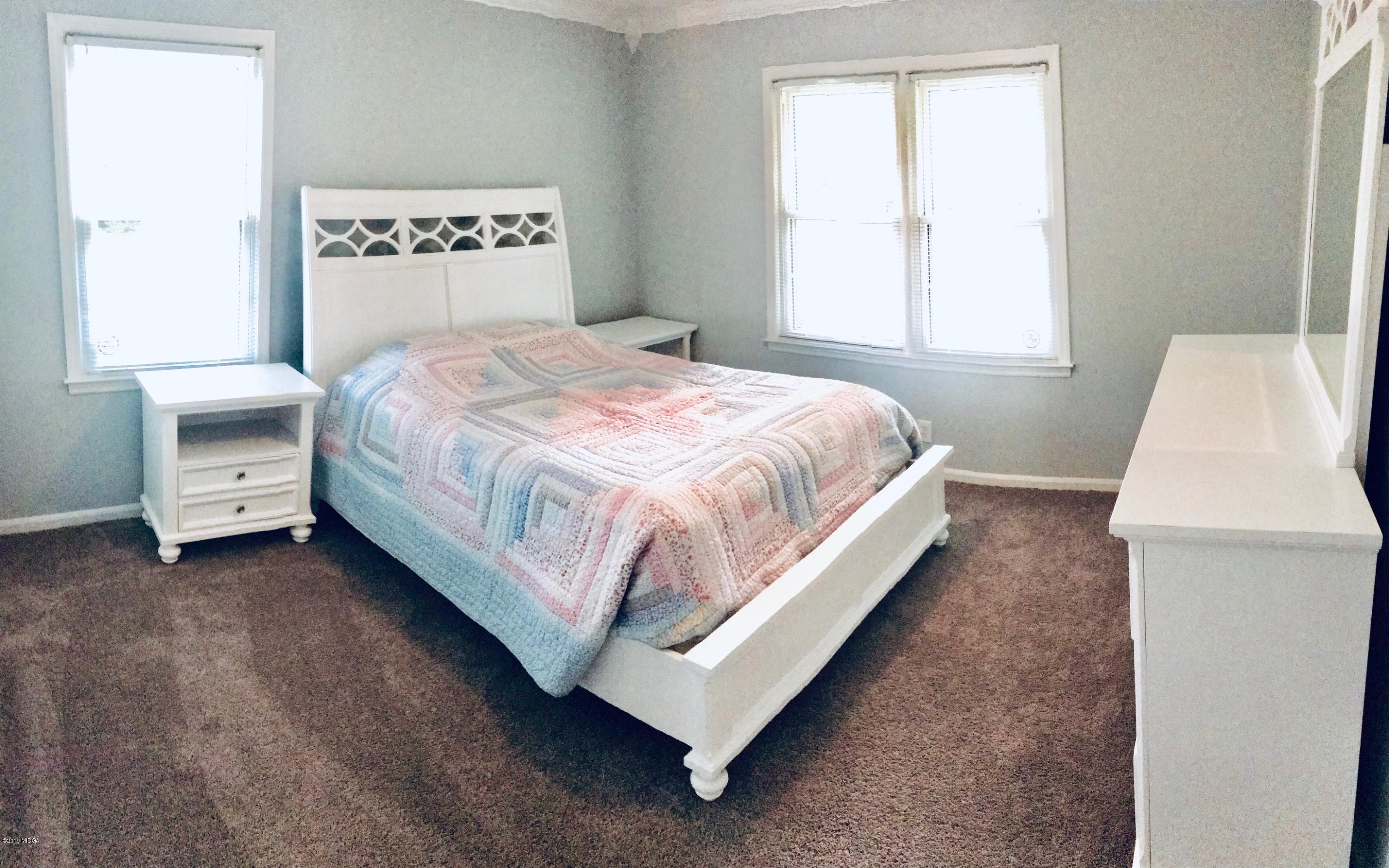 5838 School Road Macon, GA 31216 - Photo 25 of 33 a bedroom with a bed and a window