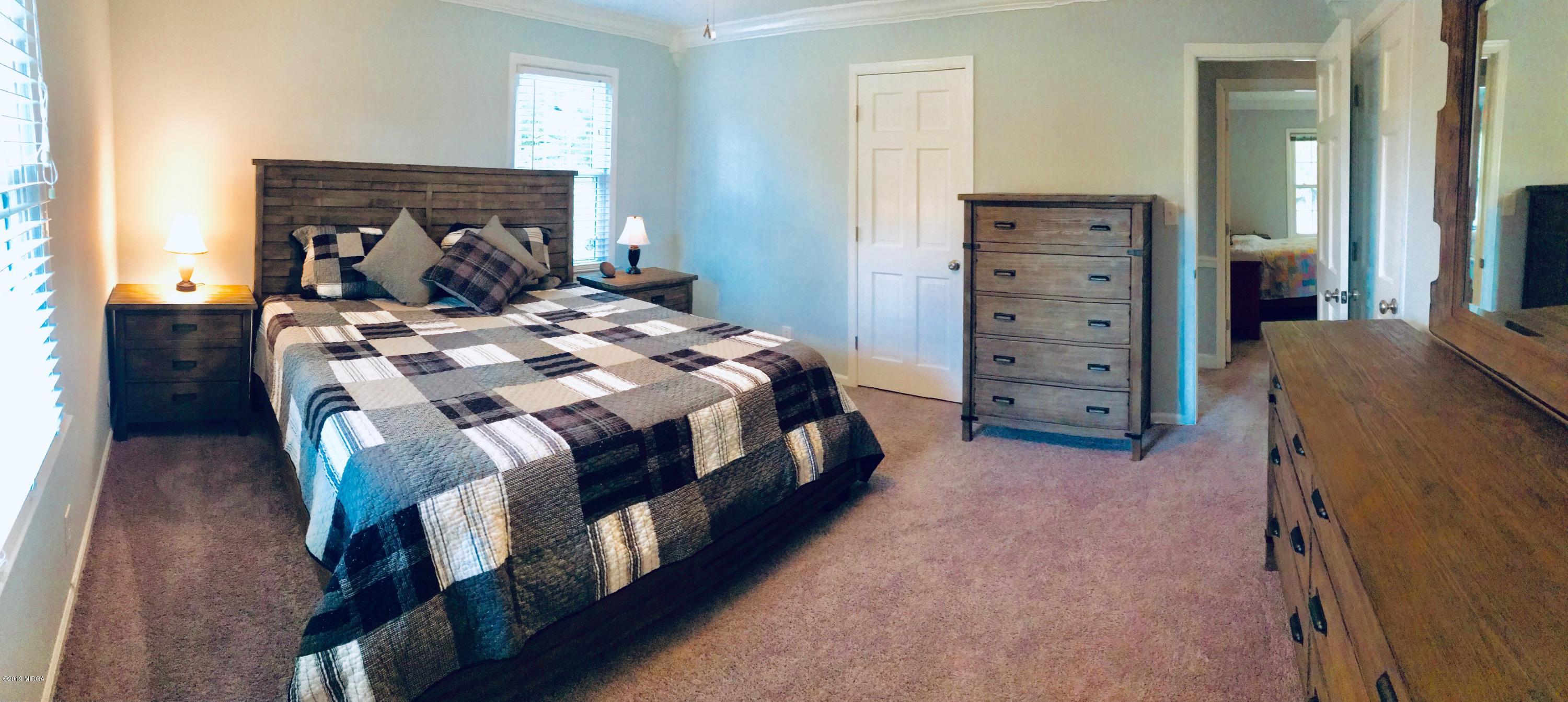 5838 School Road Macon, GA 31216 - Photo 28 of 33 a bedroom with a bed and a dresser