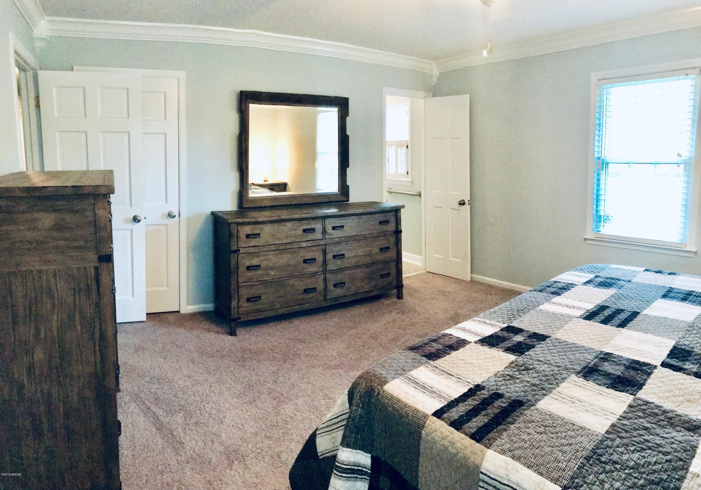 5838 School Road Macon, GA 31216 - Photo 29 of 33 a bed room with a bed and a television